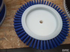 Disque de brossage pour le frottage des meules de fromage.